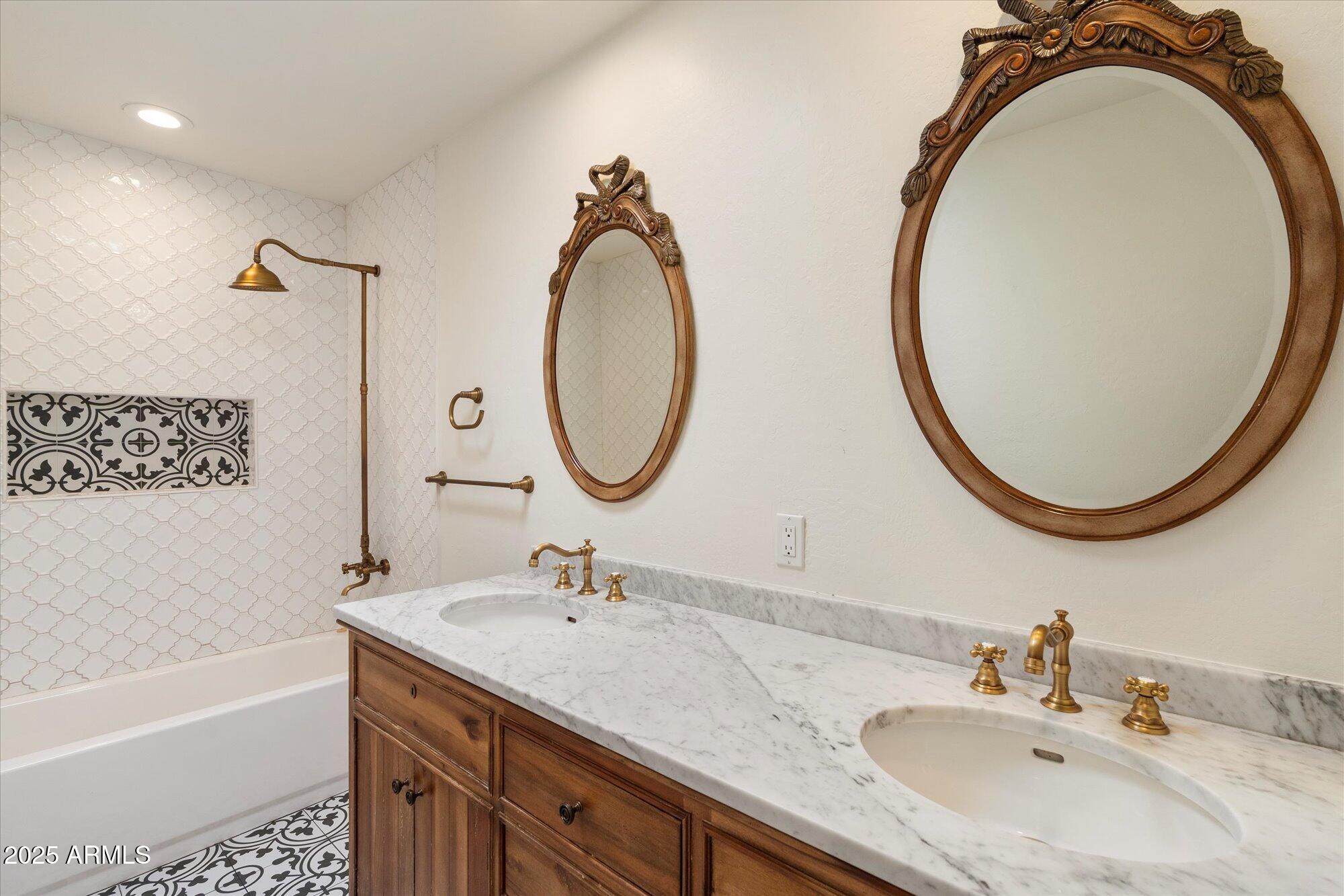 6533 East Maverick Road Paradise Valley, AZ 85253 - Photo 17 of 20 a bathroom with a granite countertop double vanity sink and a mirror