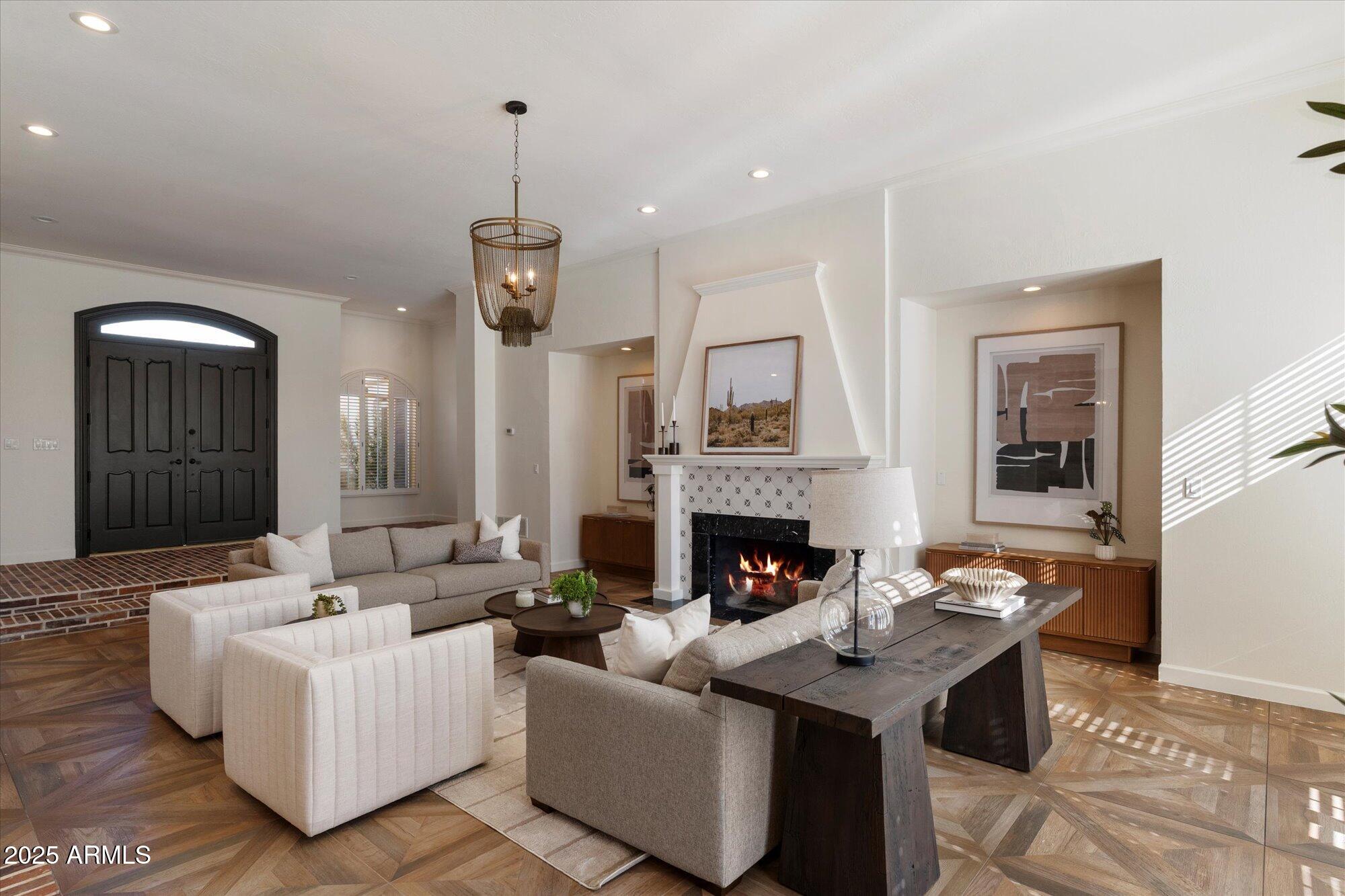 6533 East Maverick Road Paradise Valley, AZ 85253 - Photo 2 of 20 a living room with furniture and a fireplace