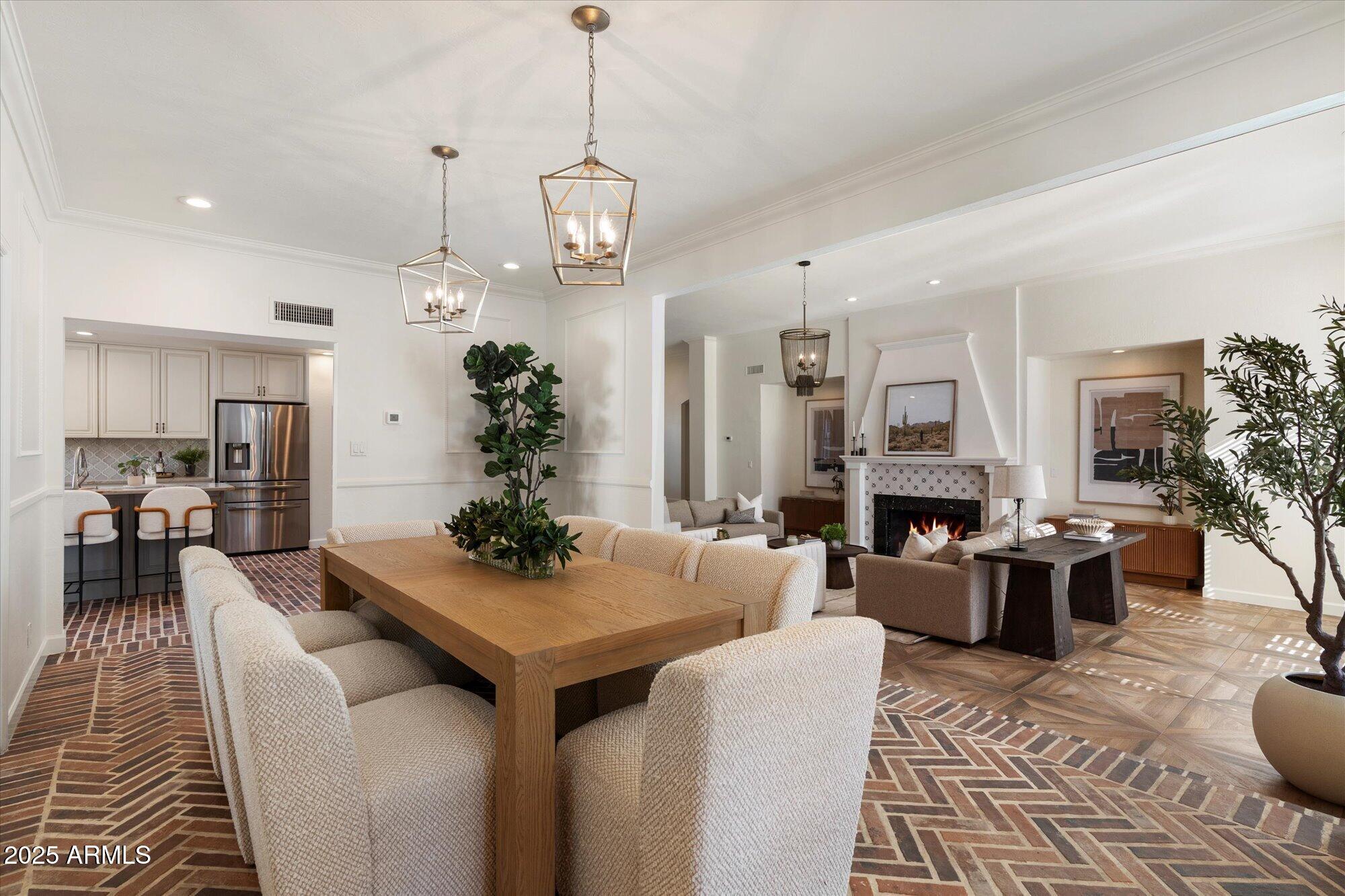 6533 East Maverick Road Paradise Valley, AZ 85253 - Photo 3 of 20 a view of a dining room with furniture window and wooden floor