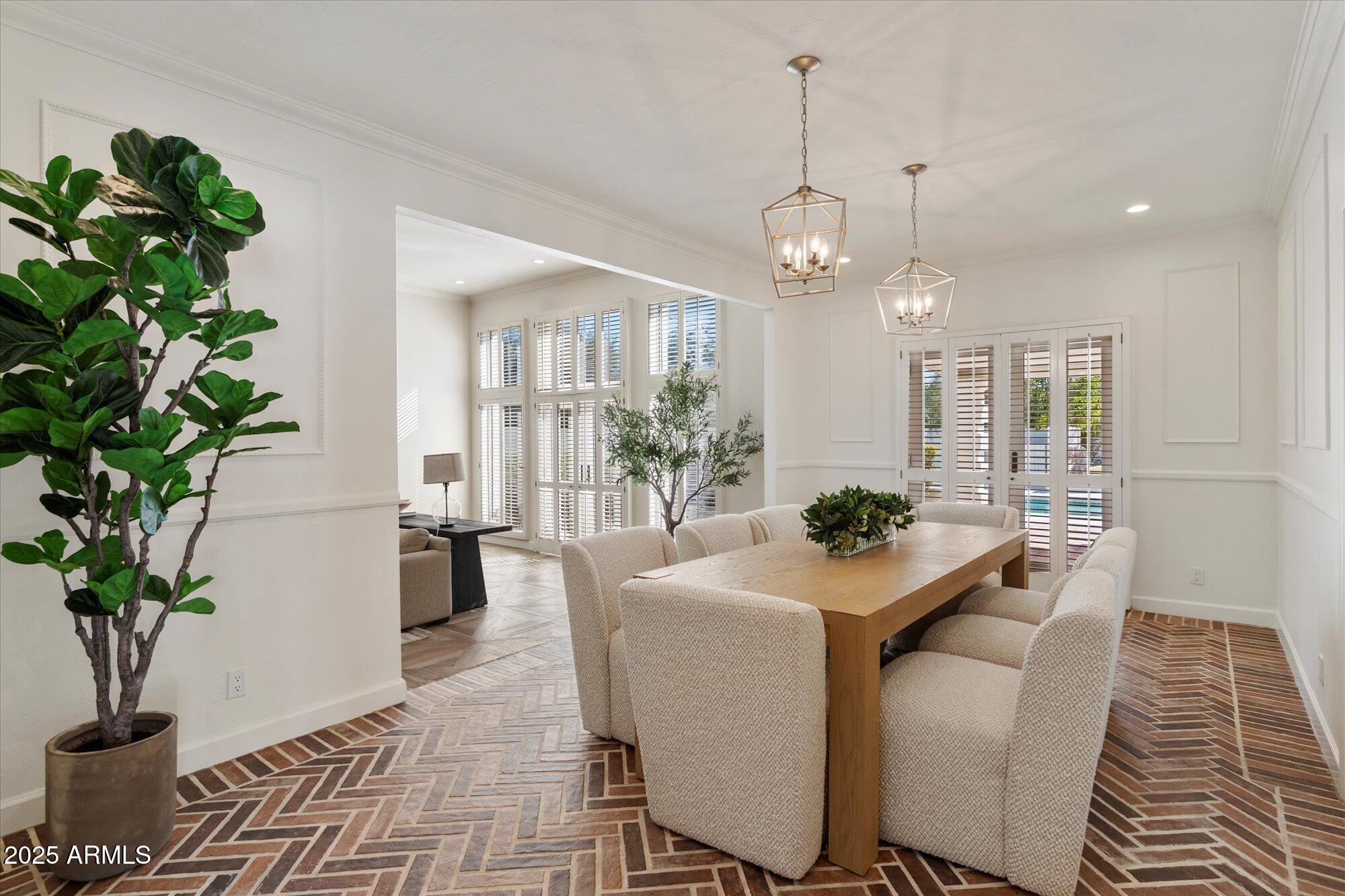 6533 East Maverick Road Paradise Valley, AZ 85253 - Photo 4 of 20 a view of a dining room with furniture window and wooden floor
