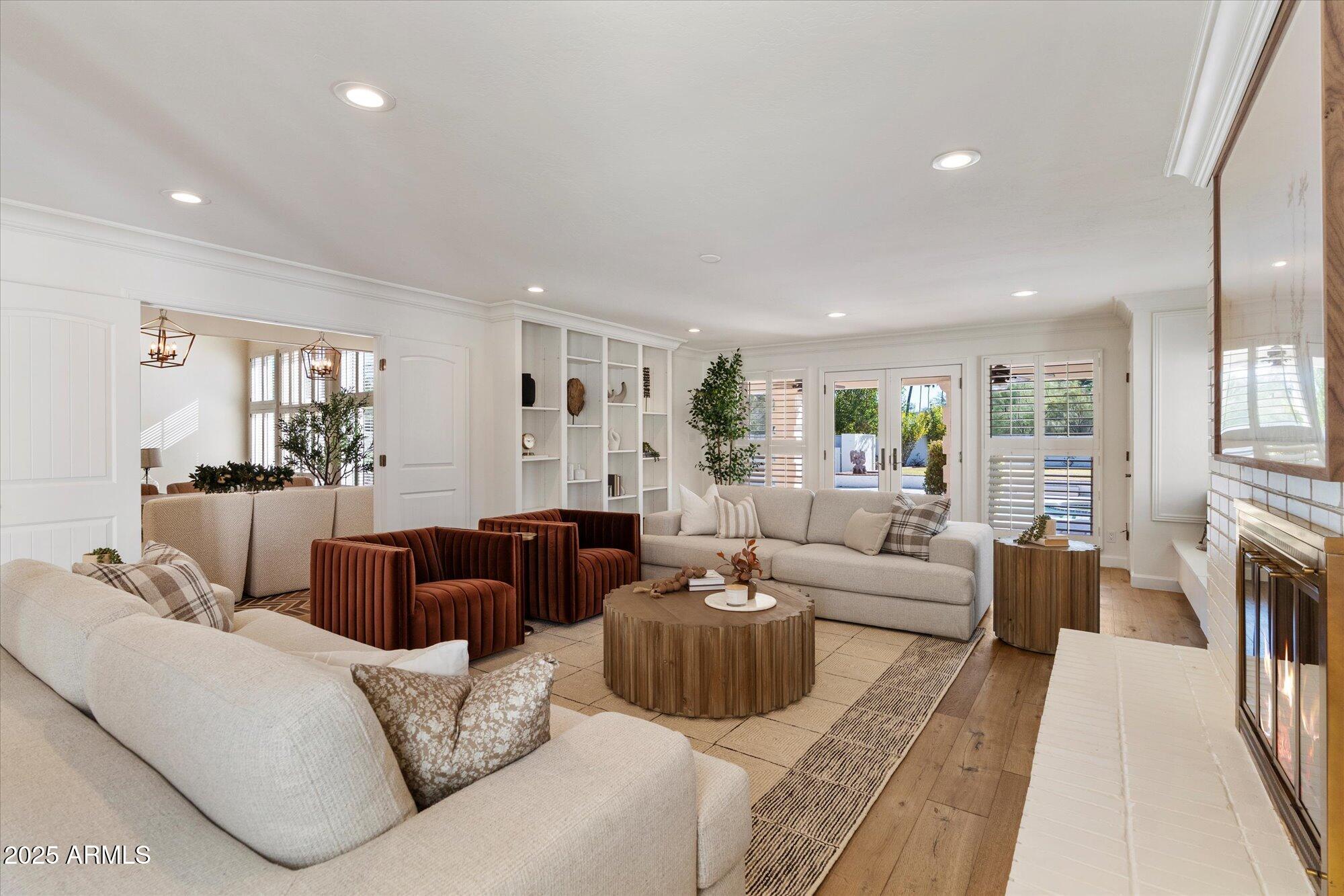 6533 East Maverick Road Paradise Valley, AZ 85253 - Photo 5 of 20 a living room with furniture fireplace and a large window