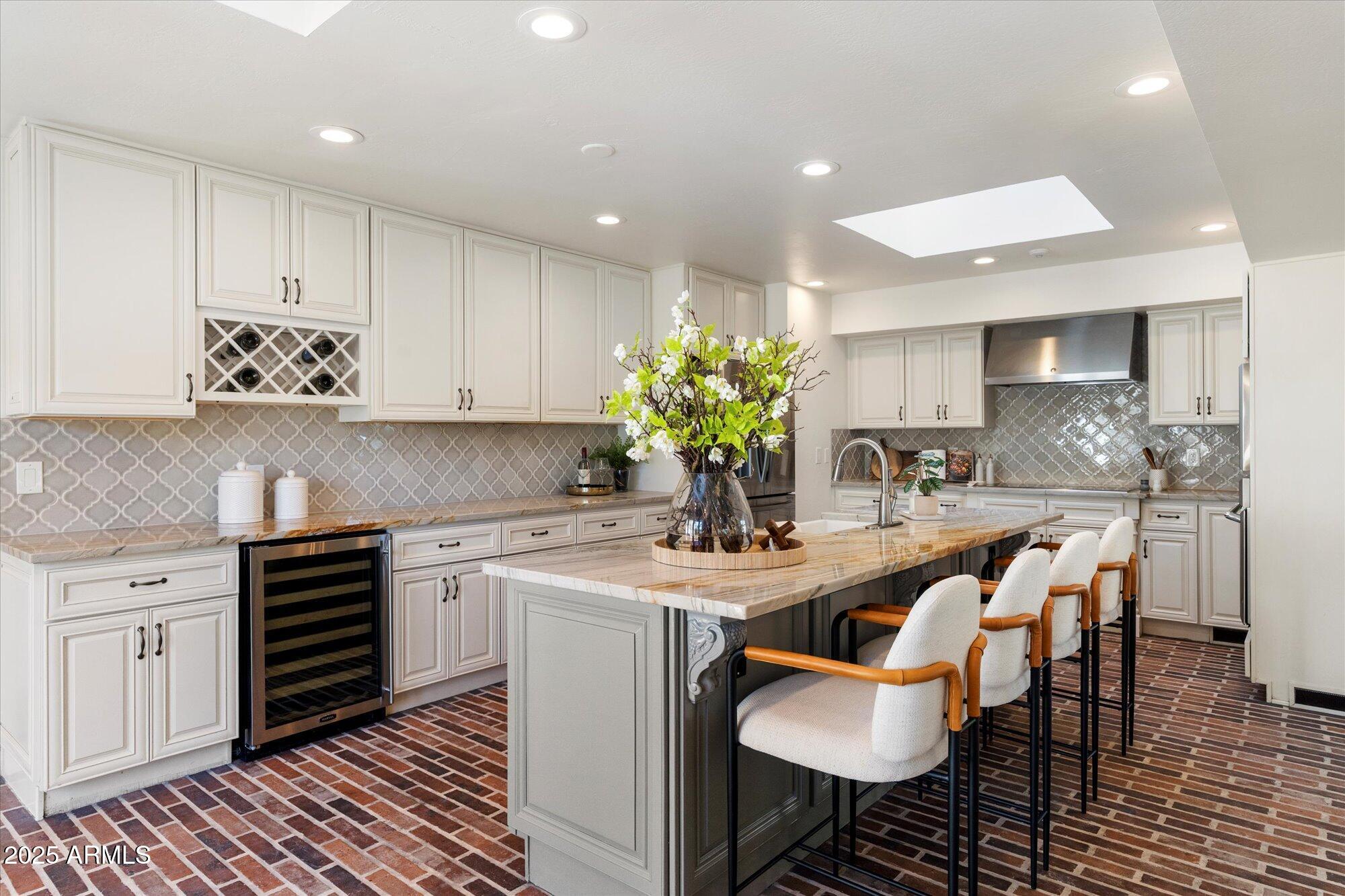 6533 East Maverick Road Paradise Valley, AZ 85253 - Photo 9 of 20 a kitchen with a sink and cabinets