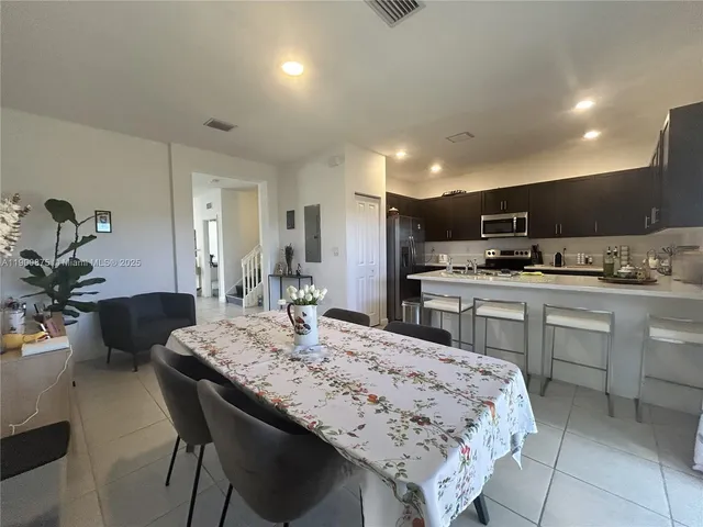 a kitchen with a sink and a stove top oven