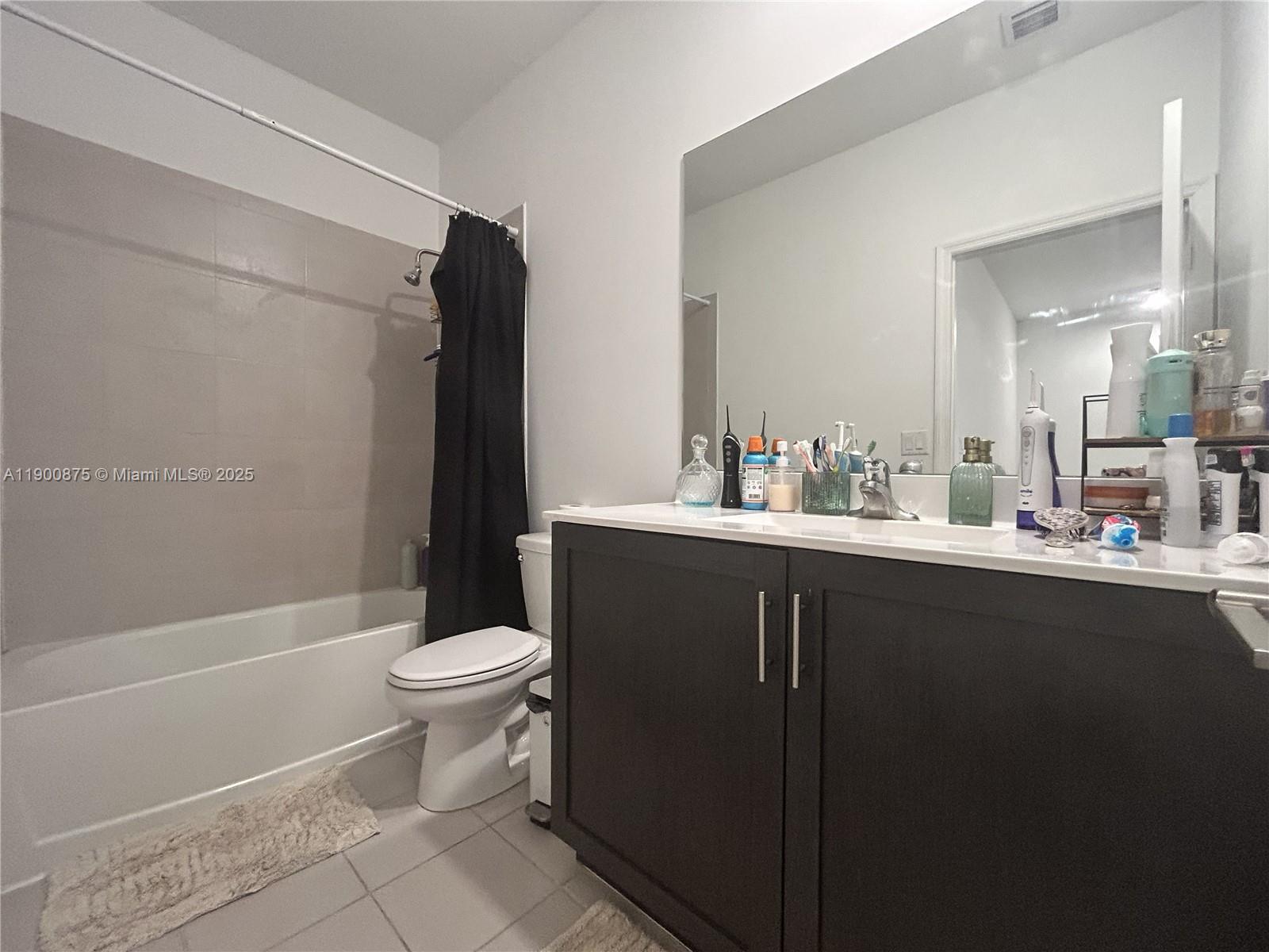 1685 Southeast 27th Street, Unit 1685 Homestead, FL 33035 - Photo 20 of 38 a bathroom with a sink a toilet and shower
