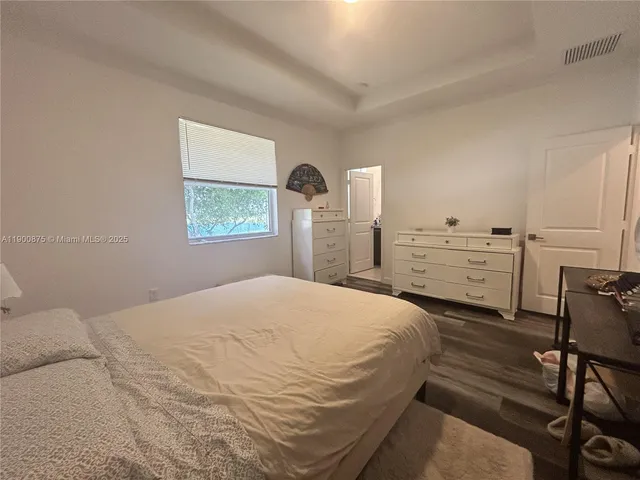 a view of walk in closet with clothes