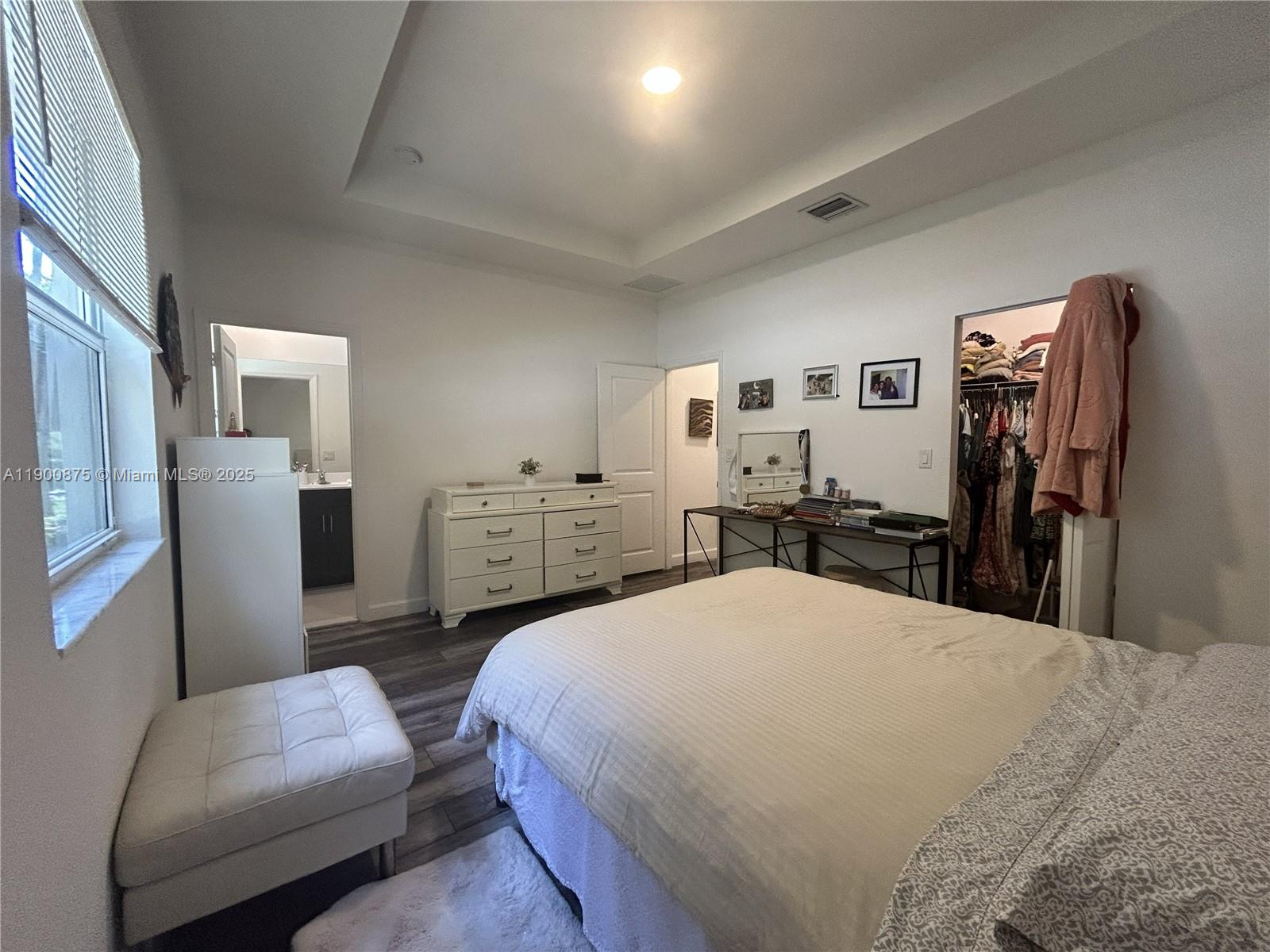 1685 Southeast 27th Street, Unit 1685 Homestead, FL 33035 - Photo 24 of 38 a large bedroom with a bed and furniture