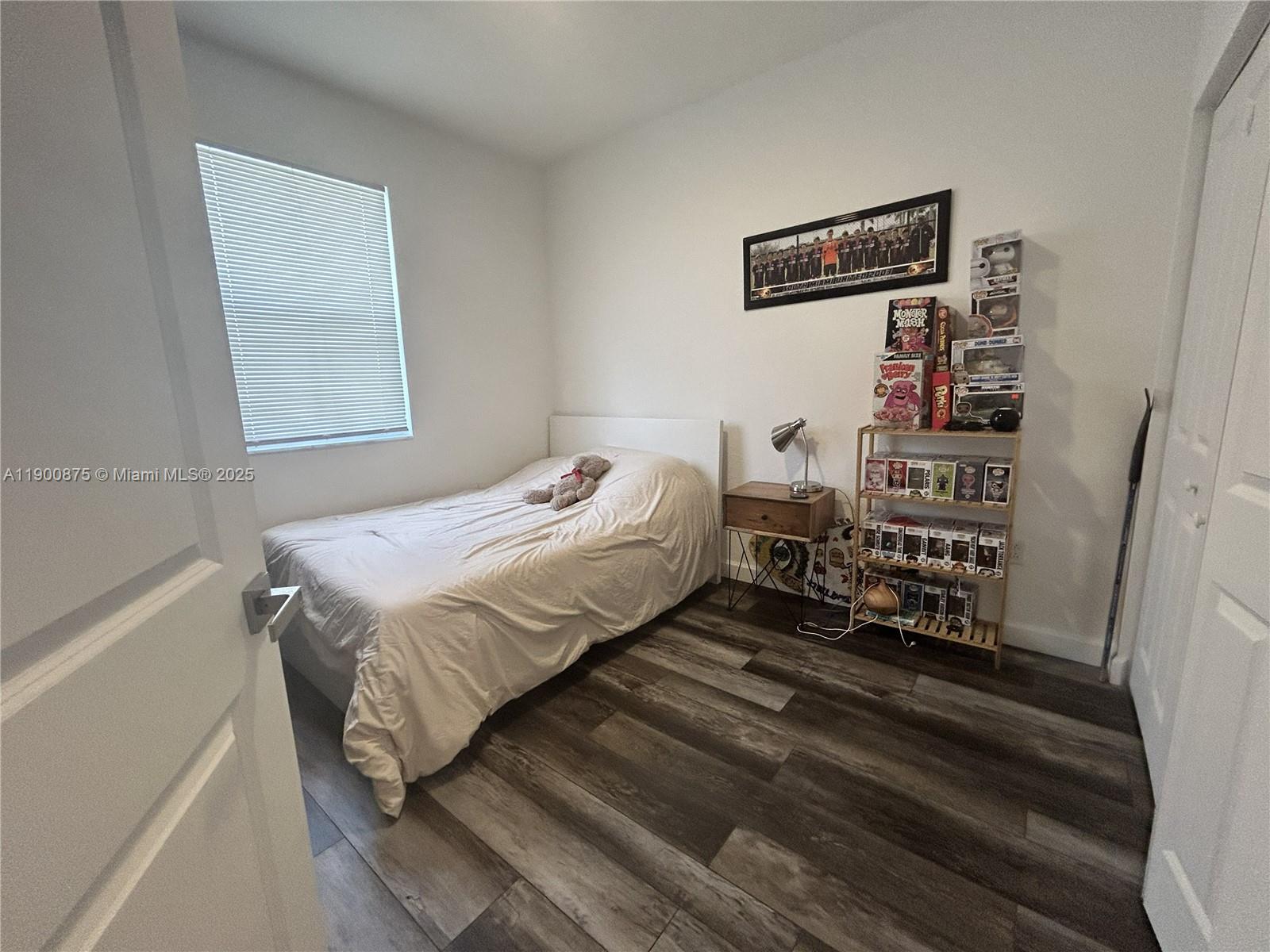 1685 Southeast 27th Street, Unit 1685 Homestead, FL 33035 - Photo 30 of 38 a bedroom with a bed and a window