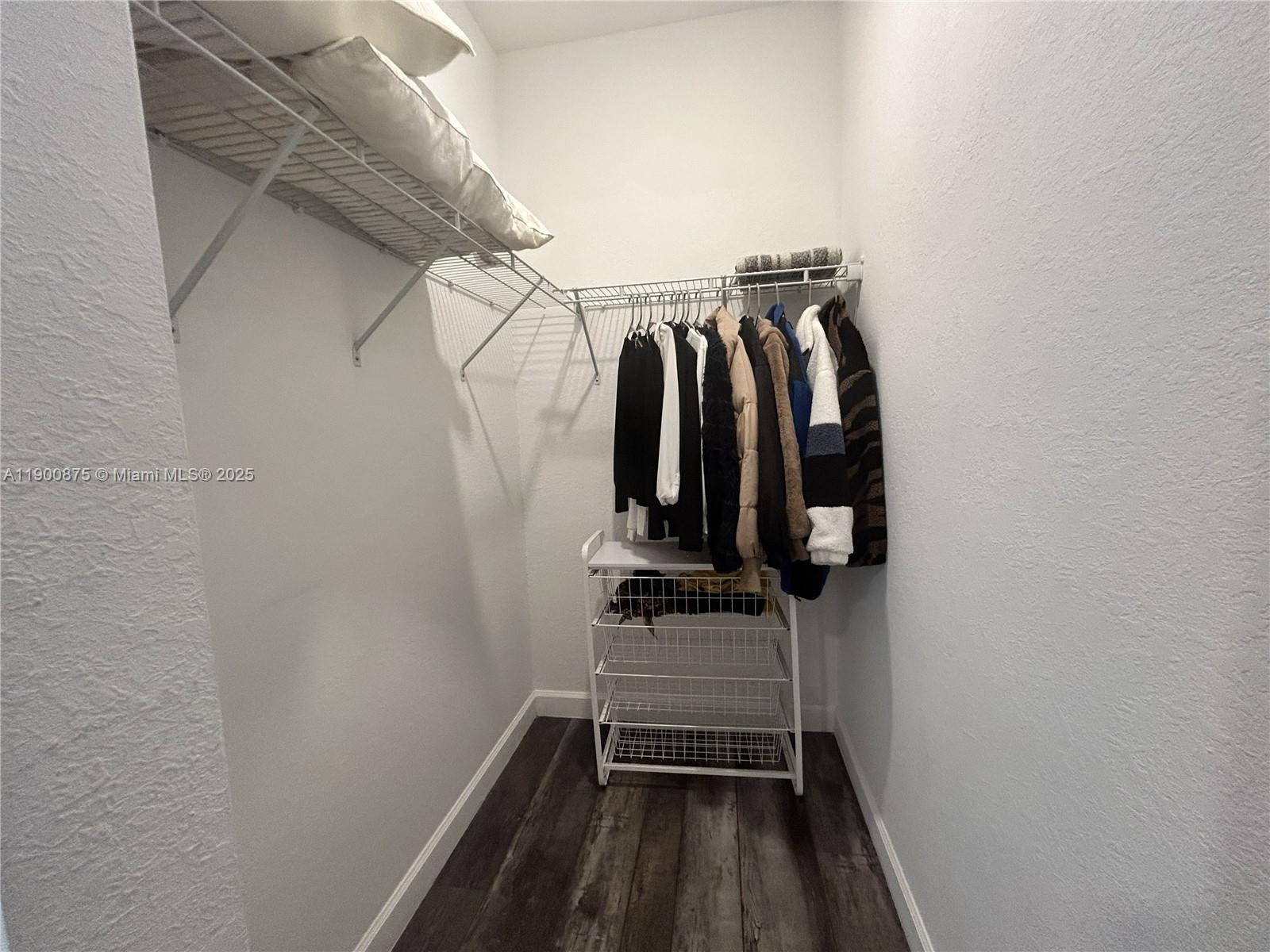 1685 Southeast 27th Street, Unit 1685 Homestead, FL 33035 - Photo 35 of 38 a view of walk in closet with clothes and shoes