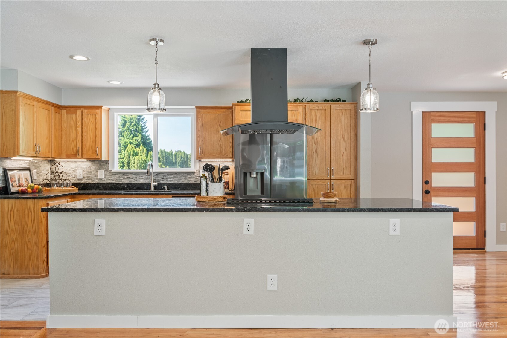 2903 Huntington Place Longview, WA 98632 - Photo 12 of 40 a kitchen with stainless steel appliances granite countertop a sink a counter space and a window