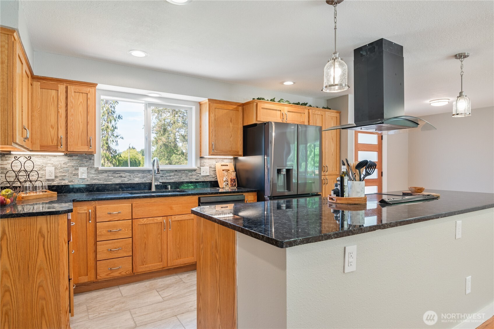 2903 Huntington Place Longview, WA 98632 - Photo 13 of 40 a kitchen with stainless steel appliances granite countertop a sink a stove and a refrigerator