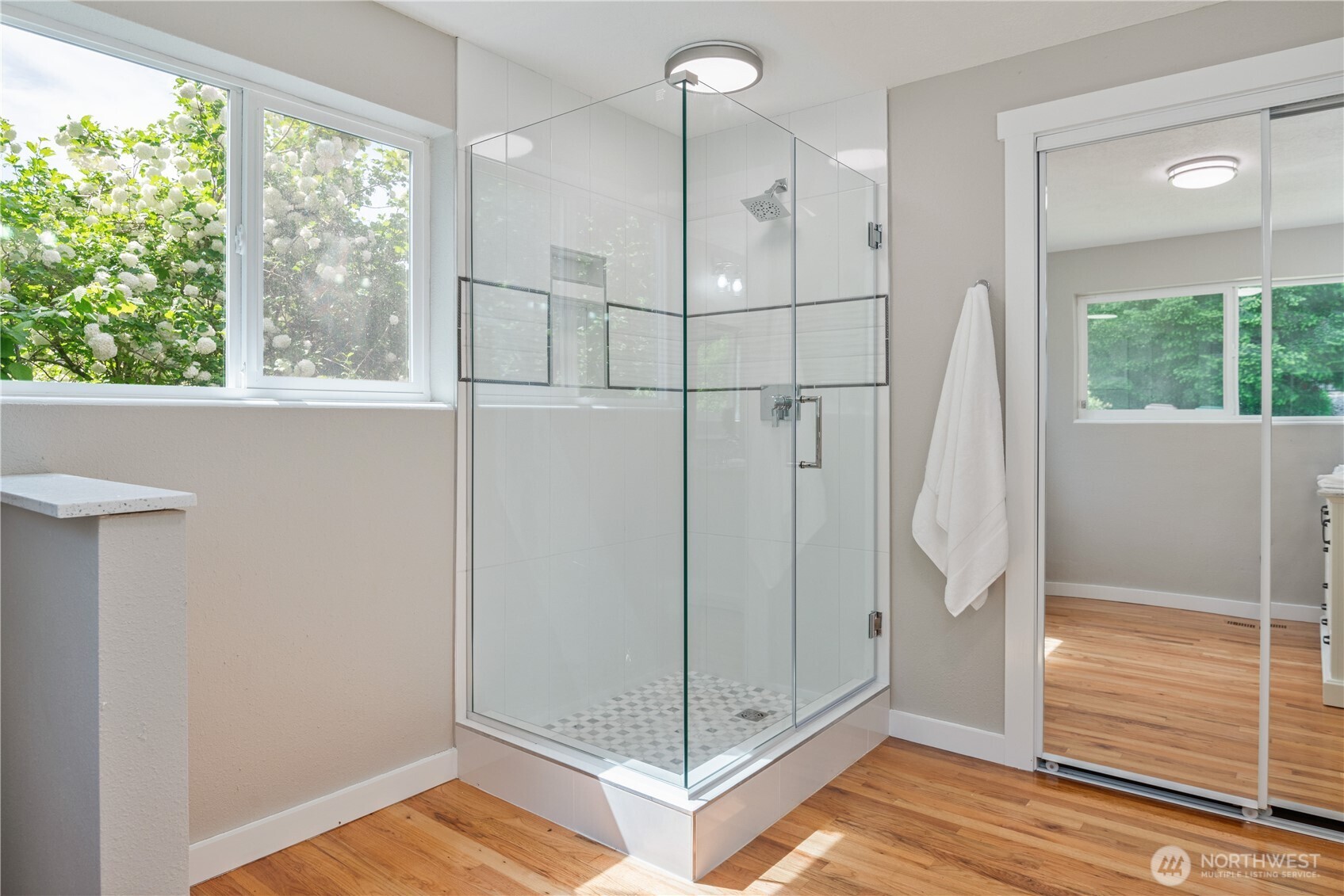 2903 Huntington Place Longview, WA 98632 - Photo 16 of 40 a view of a bathroom with a glass door shower and hardwood floor