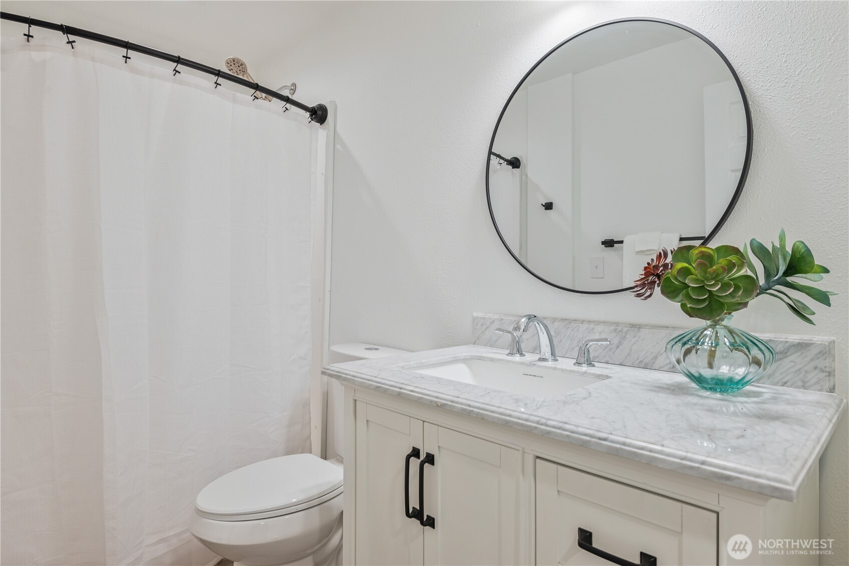 2903 Huntington Place Longview, WA 98632 - Photo 22 of 40 a bathroom with a granite countertop sink a toilet and a mirror
