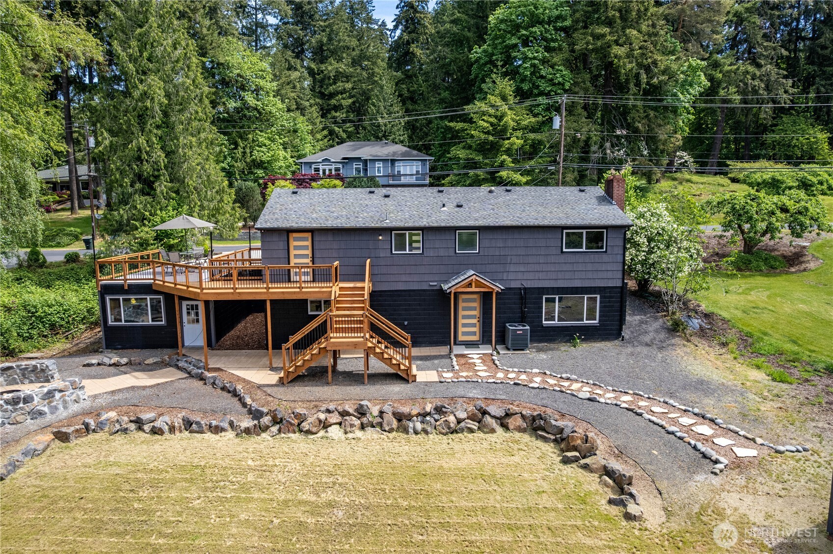 2903 Huntington Place Longview, WA 98632 - Photo 34 of 40 a view of a house with backyard swimming pool and sitting area