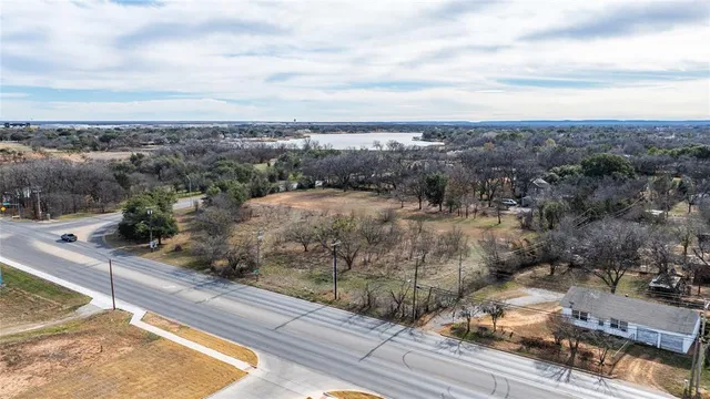 an aerial view of a houses with a yard