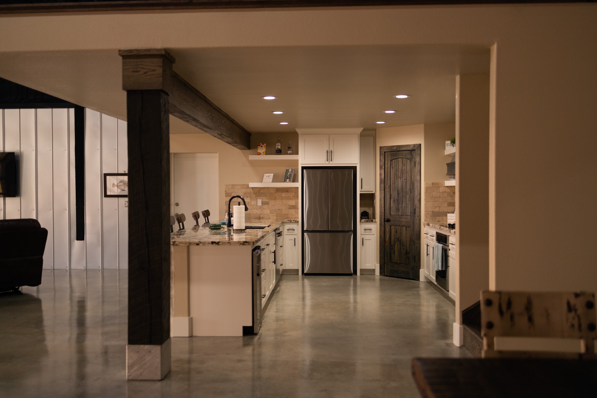 a kitchen with a refrigerator and a sink