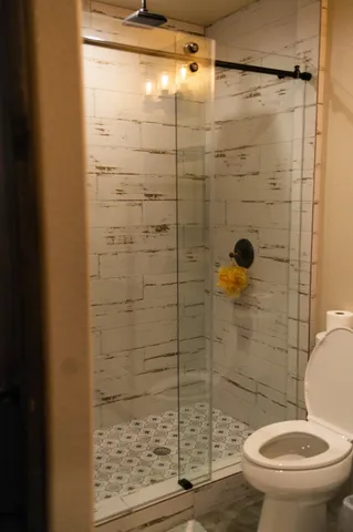 a bedroom with a bed and a lamp