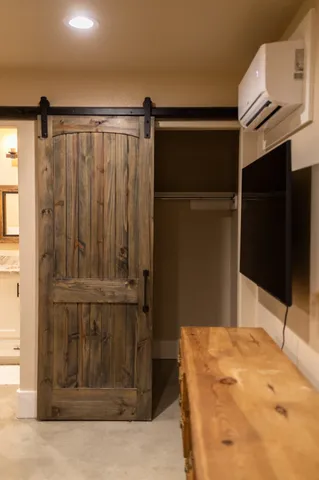 a bathroom with a shower and a mirror