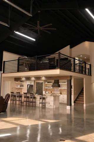 a view of a room with lots of wooden furniture