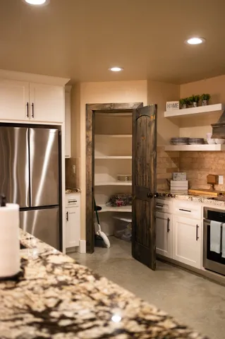 a kitchen with a stove and cabinets