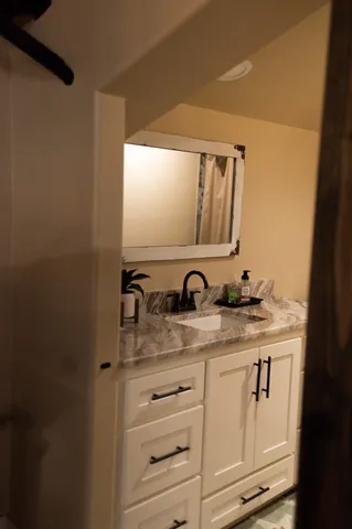 a bathroom with a shower and a bathtub