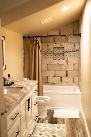 a view of a hallway with furniture and entryway