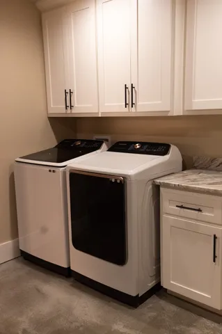 a utility room with washer and dryer