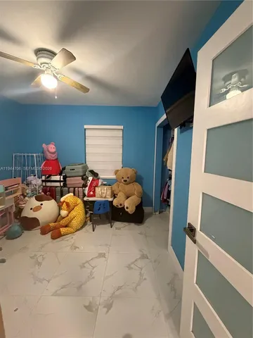 a bed room with furniture and a chandelier