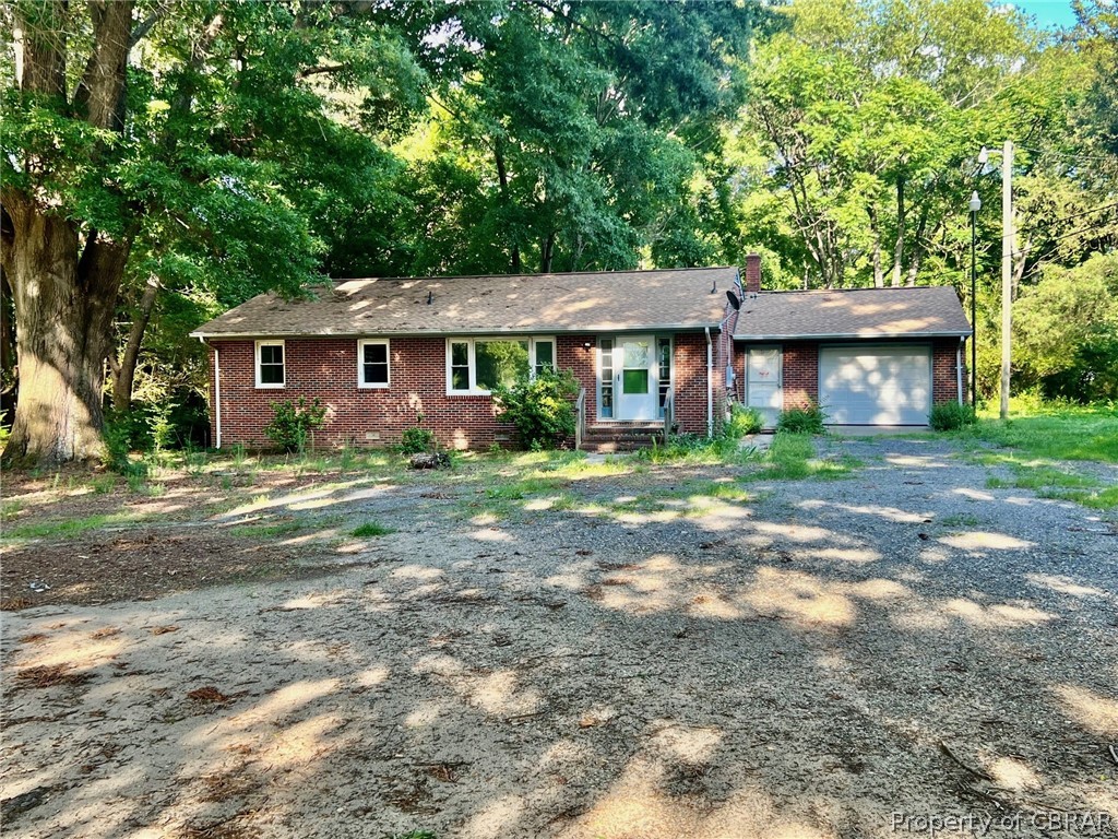 1642 Regent Road Topping, VA 23169 - Photo 4 of 10 Single story home with a garage