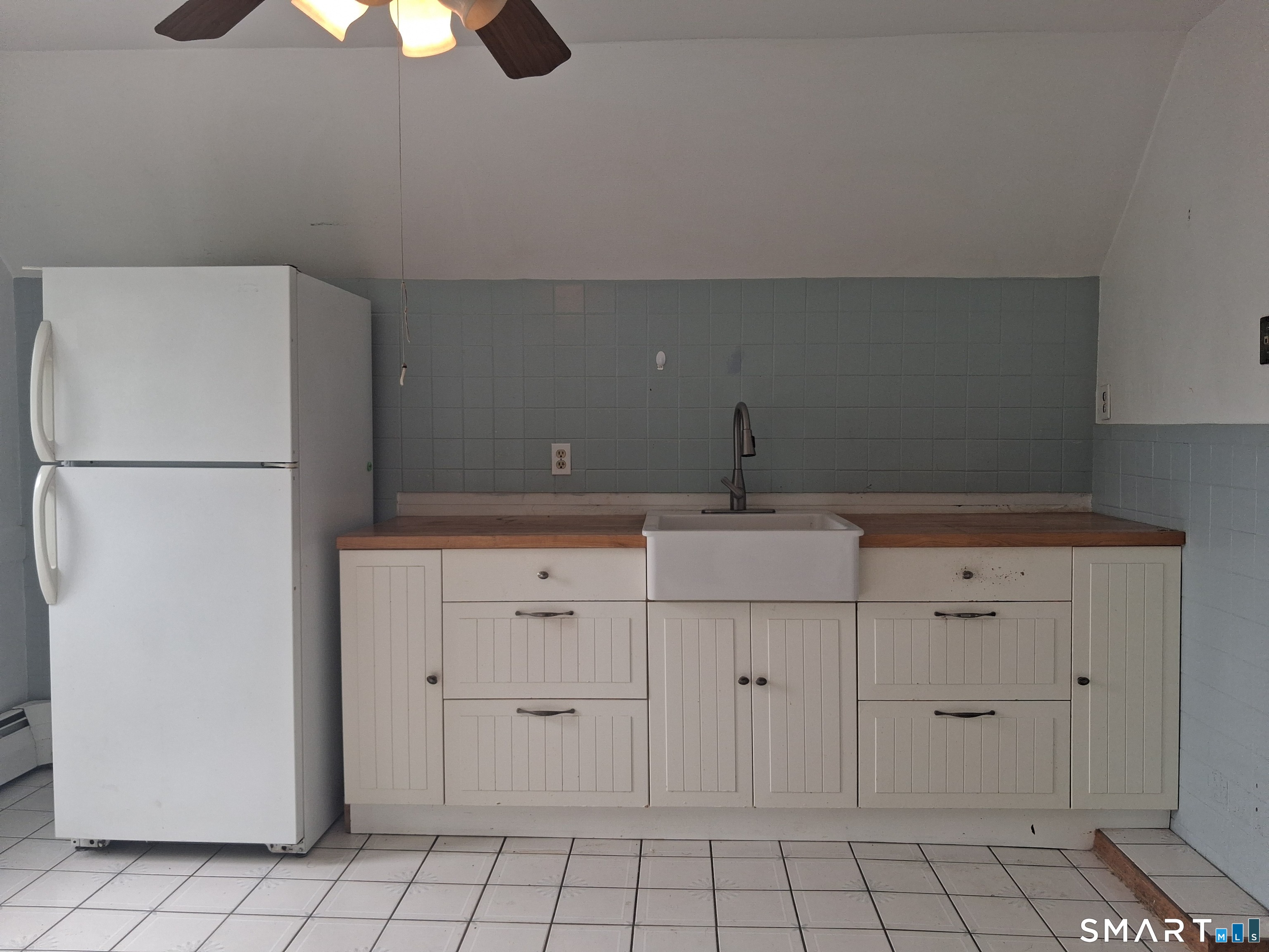 26 4th Street Hamden, CT 06514 - Photo 30 of 40 a kitchen with white cabinets