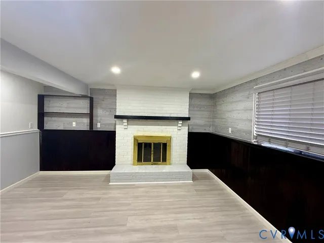 a kitchen with a refrigerator and a kitchen counter top