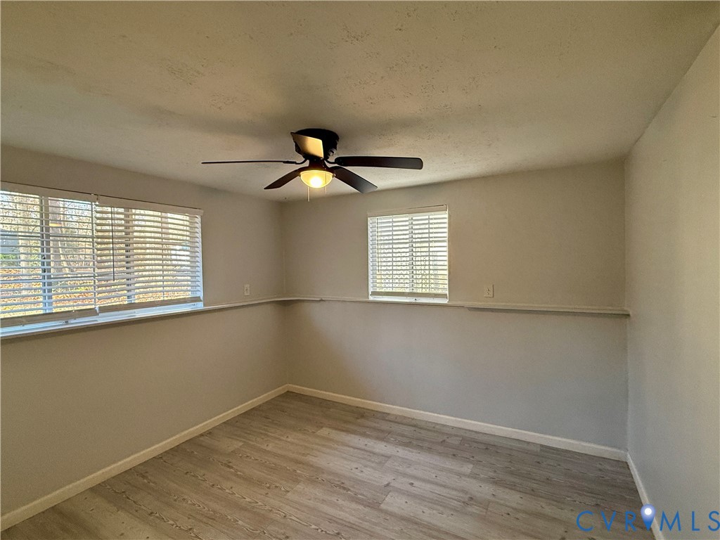 4602 Morning Hill Court Midlothian, VA 23112 - Photo 16 of 22 wooden floor in an empty room with a window