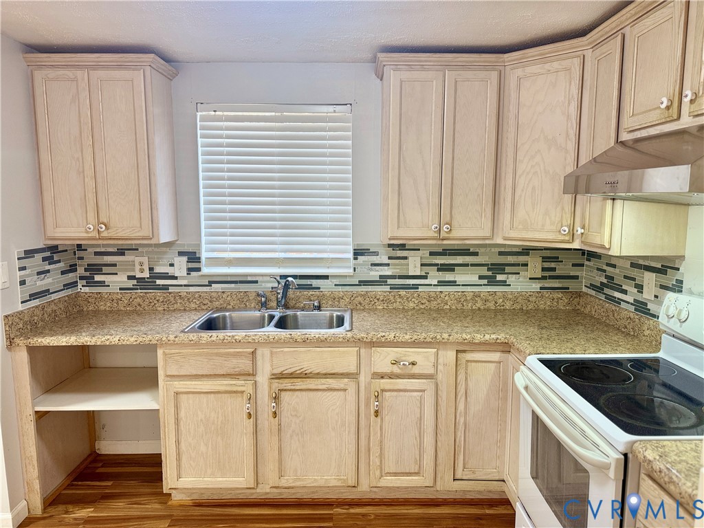 4602 Morning Hill Court Midlothian, VA 23112 - Photo 9 of 22 a kitchen with stainless steel appliances granite countertop a sink and a stove