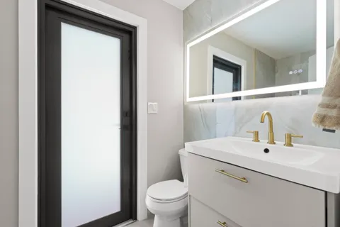 a utility room with sink dryer and washer