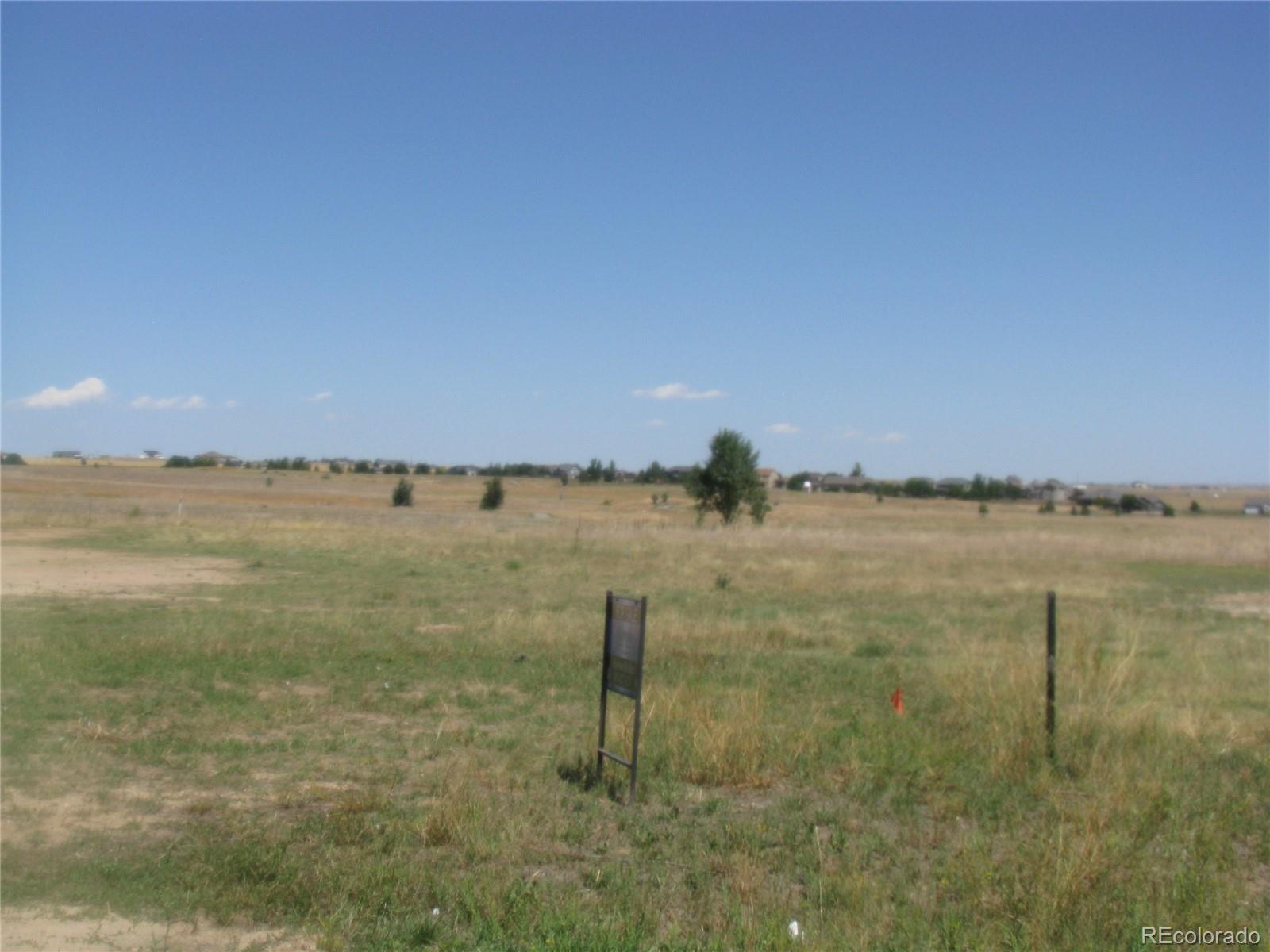 993 Pinehurst Court Bennett, CO 80102 - Photo 2 of 9 a view of a lake view
