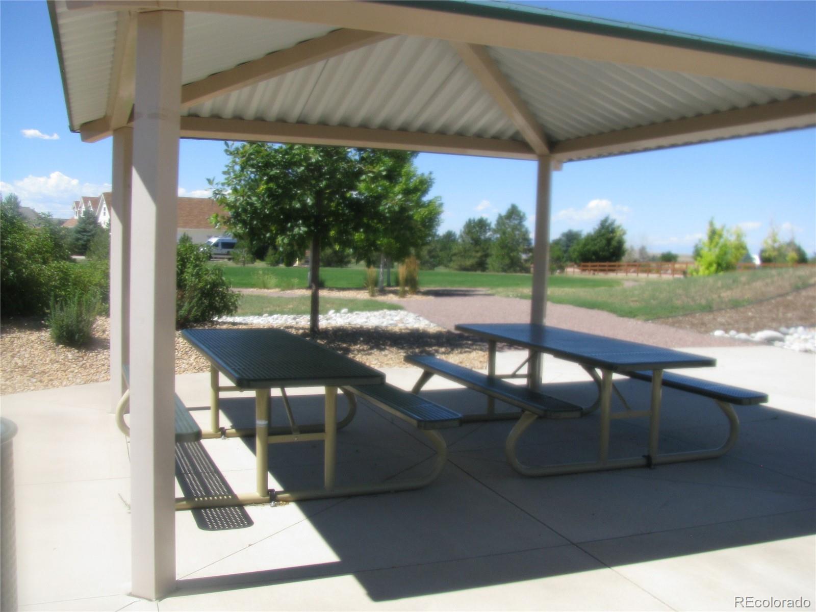 993 Pinehurst Court Bennett, CO 80102 - Photo 4 of 9 a view of swimming pool with a patio