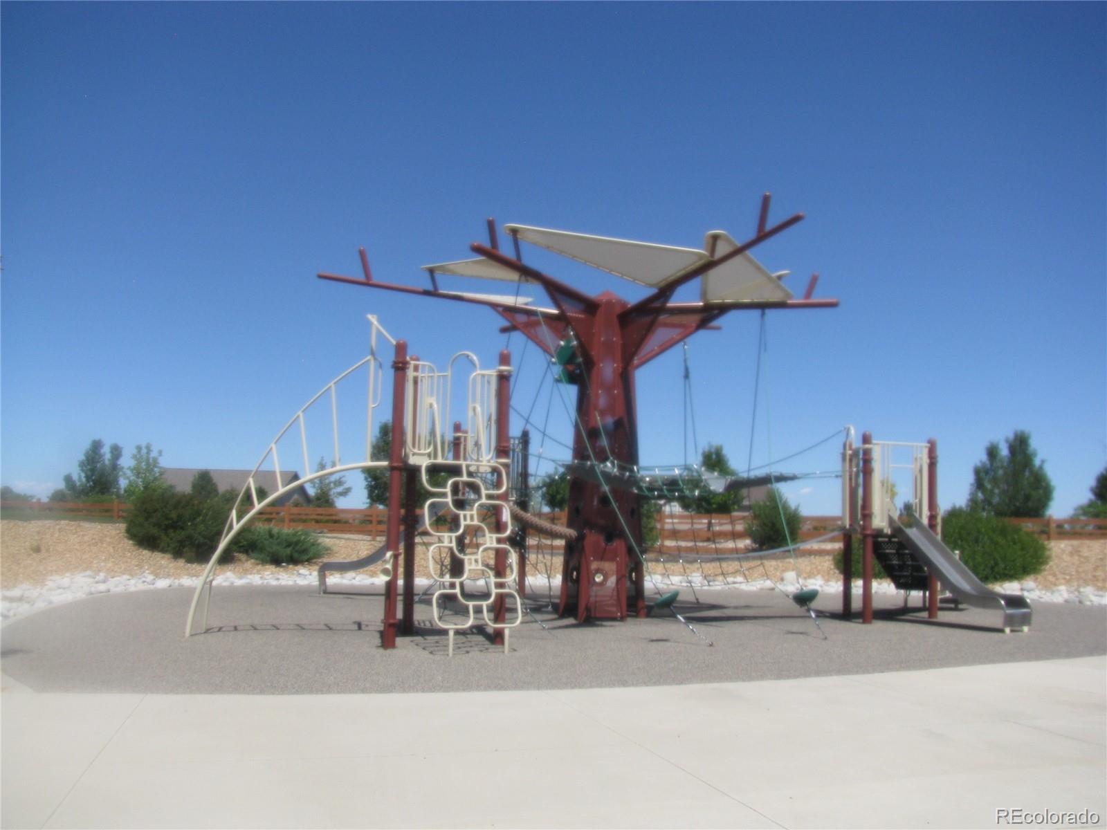 993 Pinehurst Court Bennett, CO 80102 - Photo 5 of 9 a view of a chairs and tables in patio