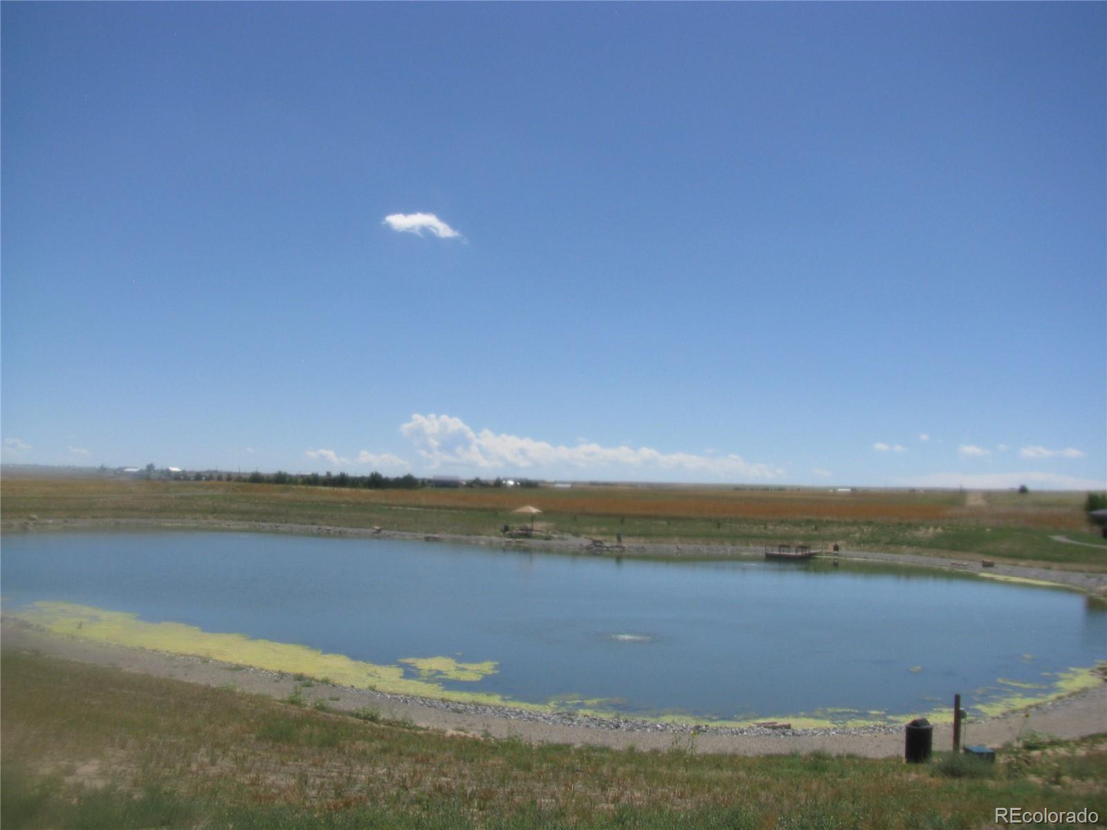 993 Pinehurst Court Bennett, CO 80102 - Photo 8 of 9 a view of an ocean and beach