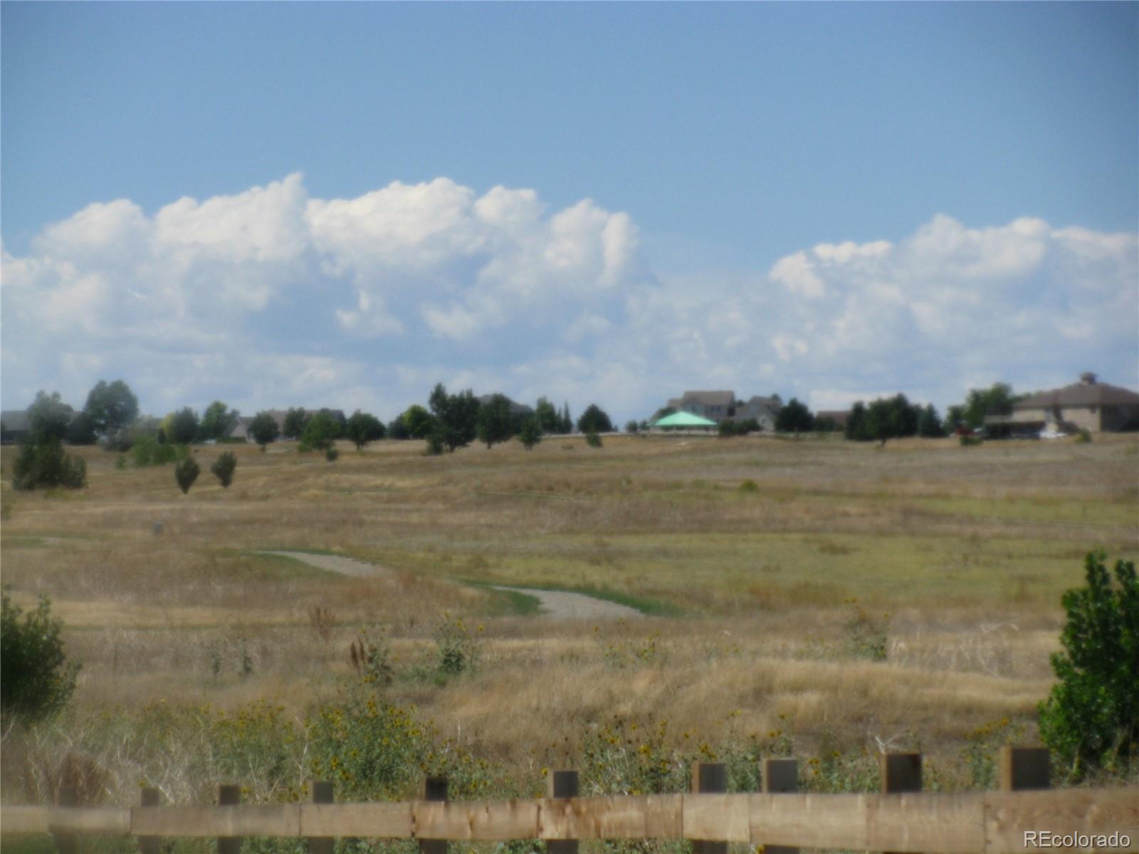 993 Pinehurst Court Bennett, CO 80102 - Photo 9 of 9 a view of a lake view