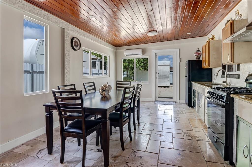 2001 43rd Terrace Southwest Naples, FL 34116 - Photo 23 of 27 a view of a dining room with furniture