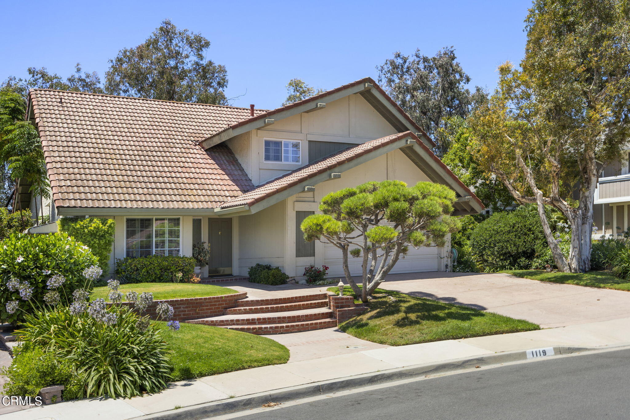 1119 Old Ranch Road Camarillo, CA 93012 - Photo 3 of 46 a front view of a house with garden
