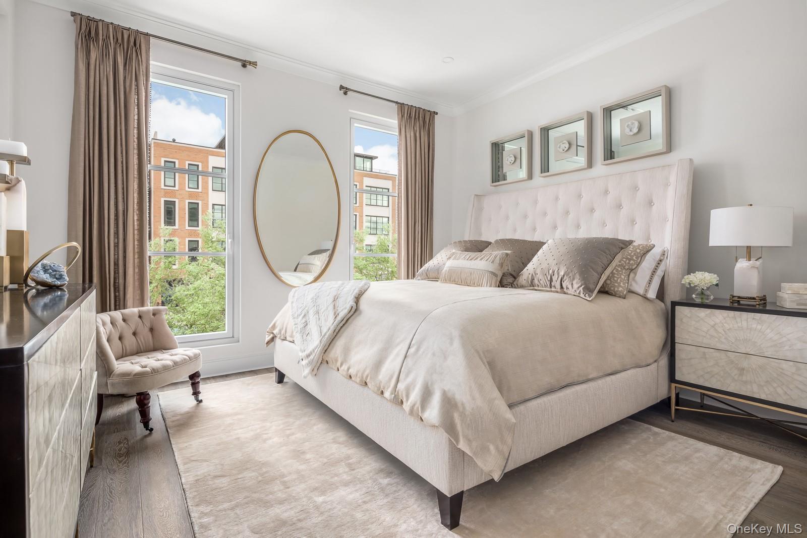 100 Garvies Point Road, Unit 1102 Glen Cove, NY 11542 - Photo 6 of 16 a bed room with a bed and a large window