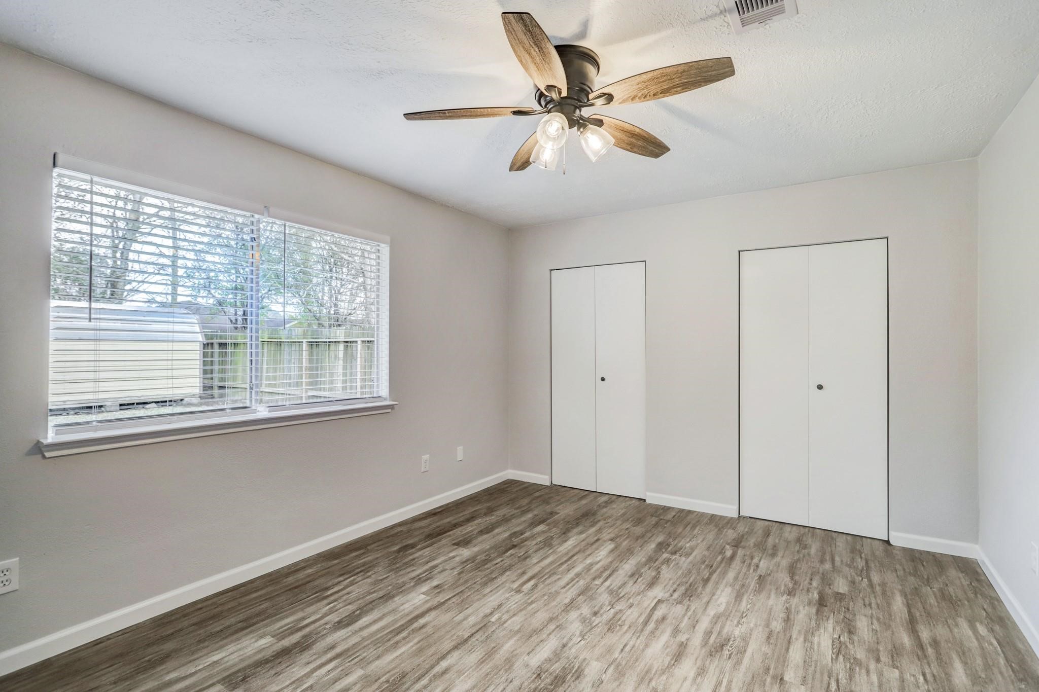15910 Plover Court Humble, TX 77396 - Photo 6 of 10 a view of a livingroom with a ceiling fan and window