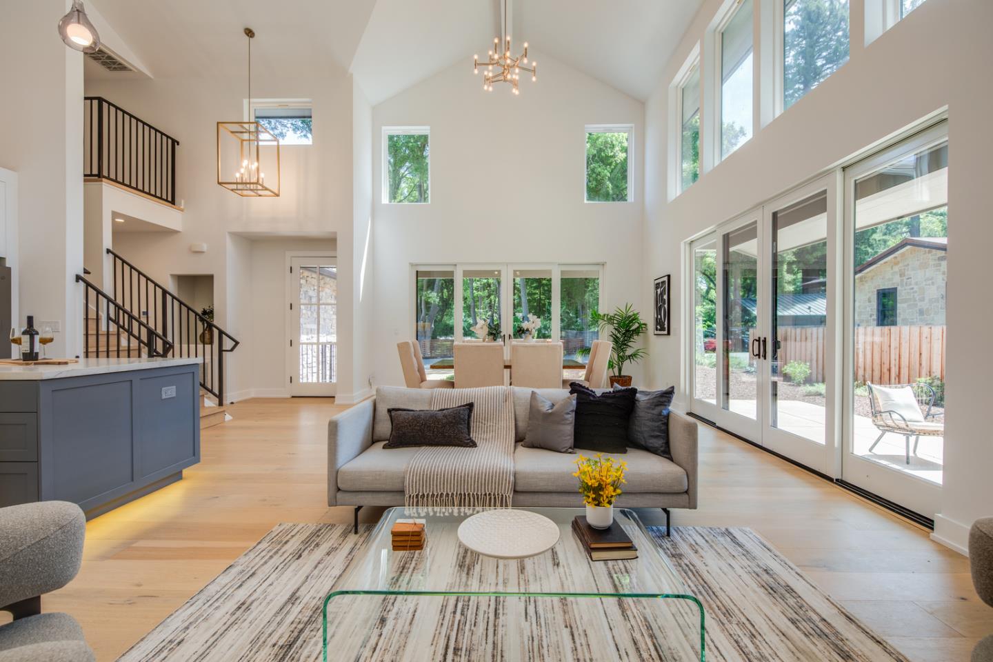 846 Portola Road Portola Valley, CA 94028 - Photo 13 of 80 a living room with furniture large window and wooden floor