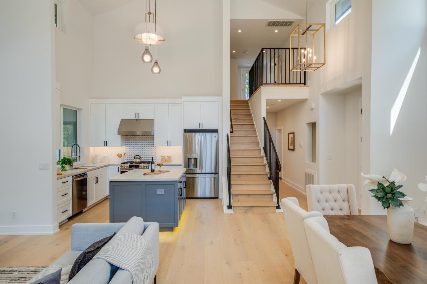 846 Portola Road Portola Valley, CA 94028 - Photo 15 of 80 a kitchen with granite countertop a refrigerator a stove a sink dishwasher and white cabinets with wooden floor