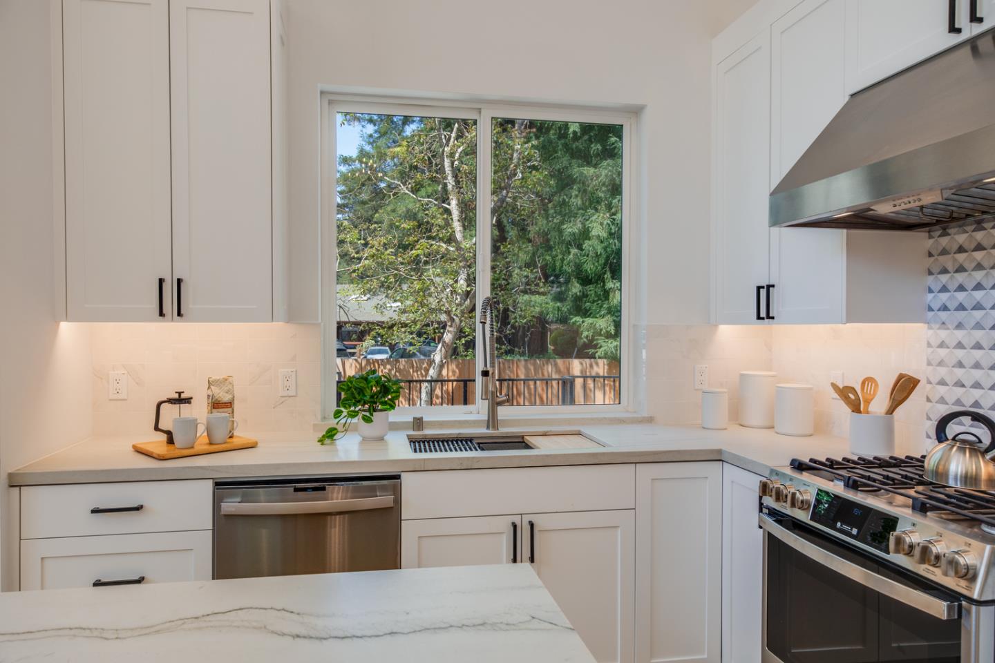 846 Portola Road Portola Valley, CA 94028 - Photo 17 of 80 a kitchen with stainless steel appliances white cabinets and a stove top oven