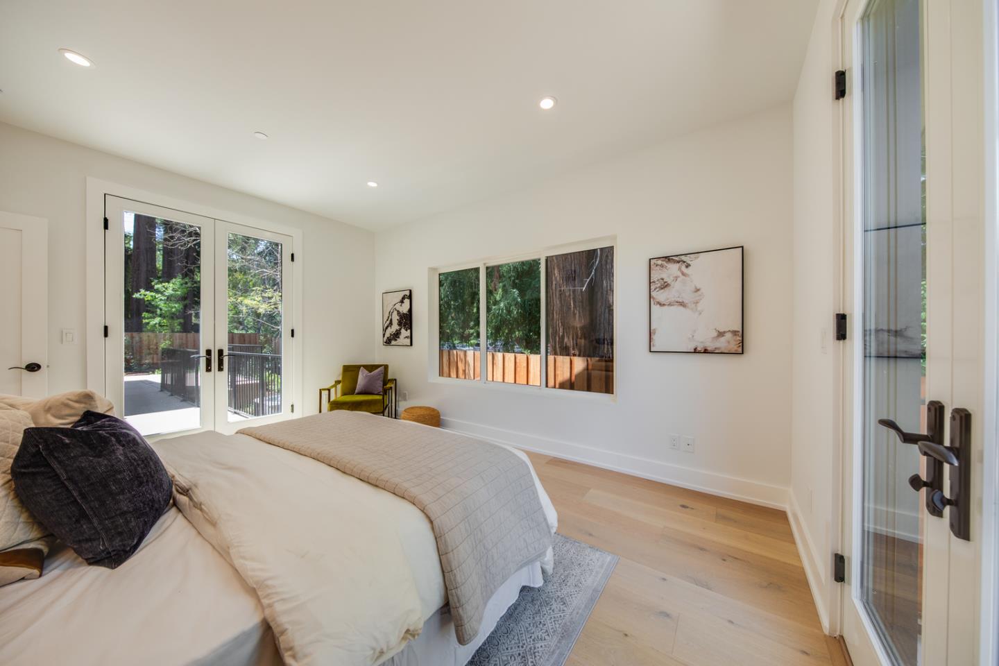 846 Portola Road Portola Valley, CA 94028 - Photo 27 of 80 a bedroom with a bed and a large window