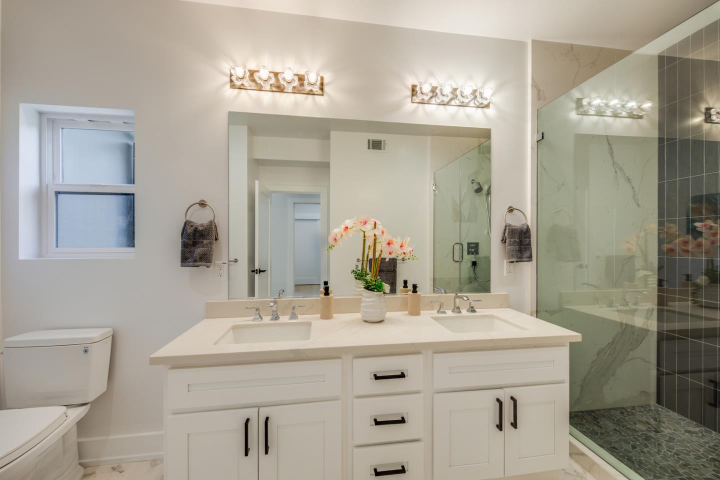 846 Portola Road Portola Valley, CA 94028 - Photo 29 of 80 a bathroom with a sink double vanity and a mirror