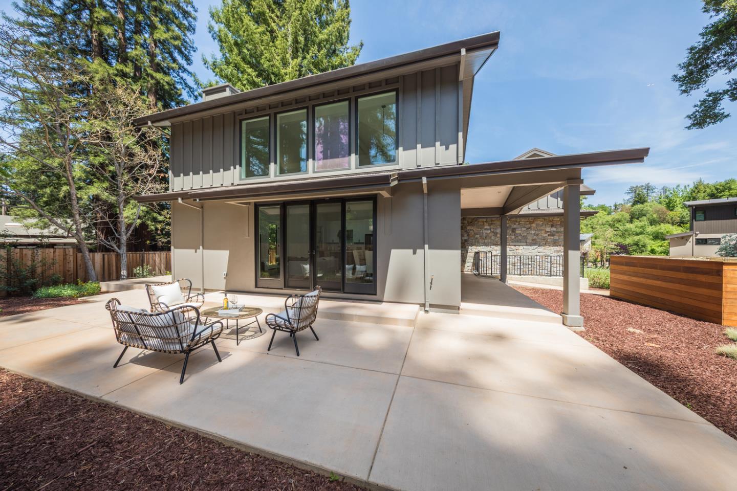 846 Portola Road Portola Valley, CA 94028 - Photo 72 of 80 a view of a patio with table and chairs and potted plants