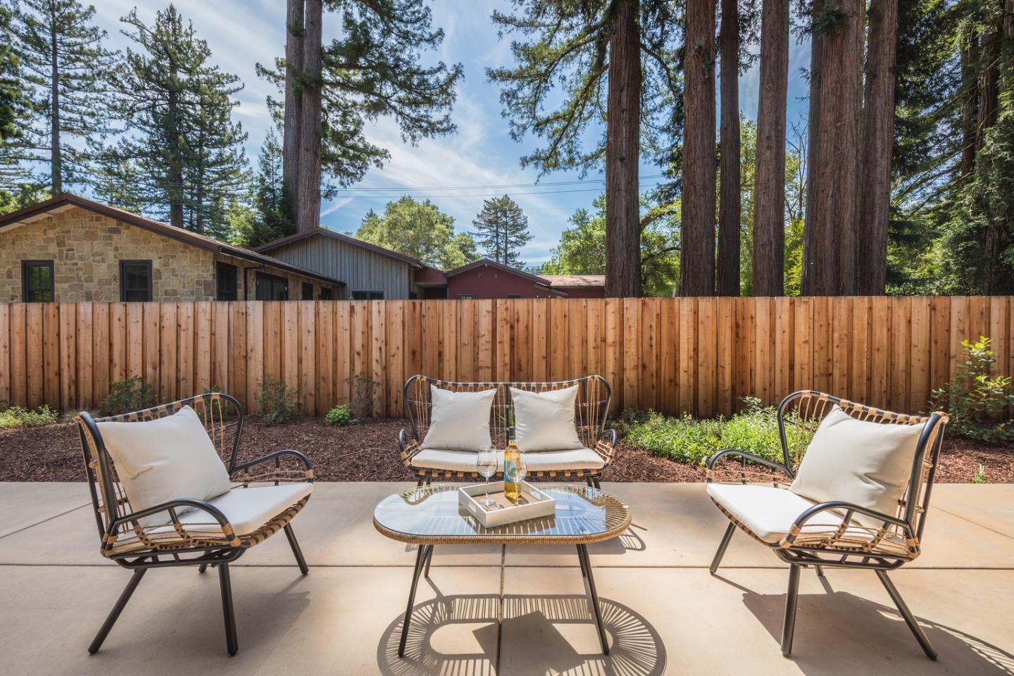 846 Portola Road Portola Valley, CA 94028 - Photo 73 of 80 a backyard of a house with table and chairs