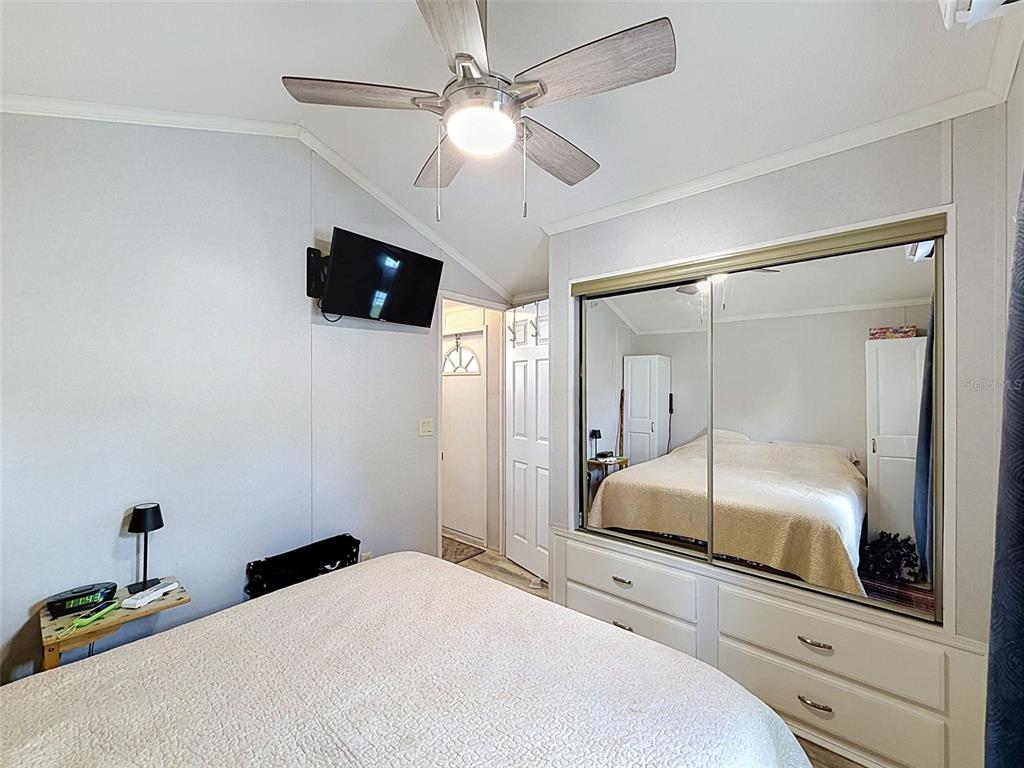 2092 Culbreath Road, Unit A42 Brooksville, FL 34602 - Photo 61 of 70 a bedroom with a bed and a flat tv screen